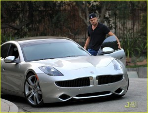 Leo DiCaprio with hybrid electric car